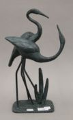 A pair of patinated bronze cranes. 37 cm high.