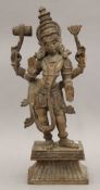 An Eastern carved wooden deity. 55 cm high.
