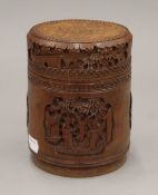 A Chinese cylindrical bamboo box, carved with various figures and mythical beasts,