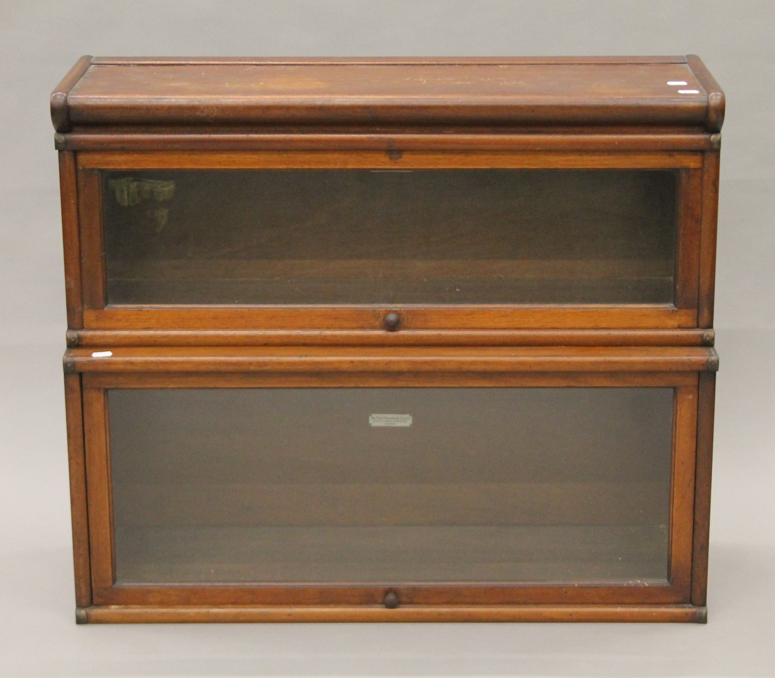 A two-stack mahogany Globe Wernicke bookcase. 86 cm wide, 73 cm high, 29 cm deep.