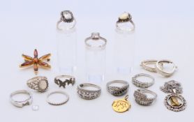 A quantity of silver jewellery, including rings, a pair of earrings, a brooch and two pendants.