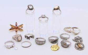 A quantity of silver jewellery, including rings, a pair of earrings, a brooch and two pendants.