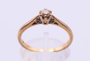 A 9 ct gold and diamond solitaire ring. Ring size O/P.