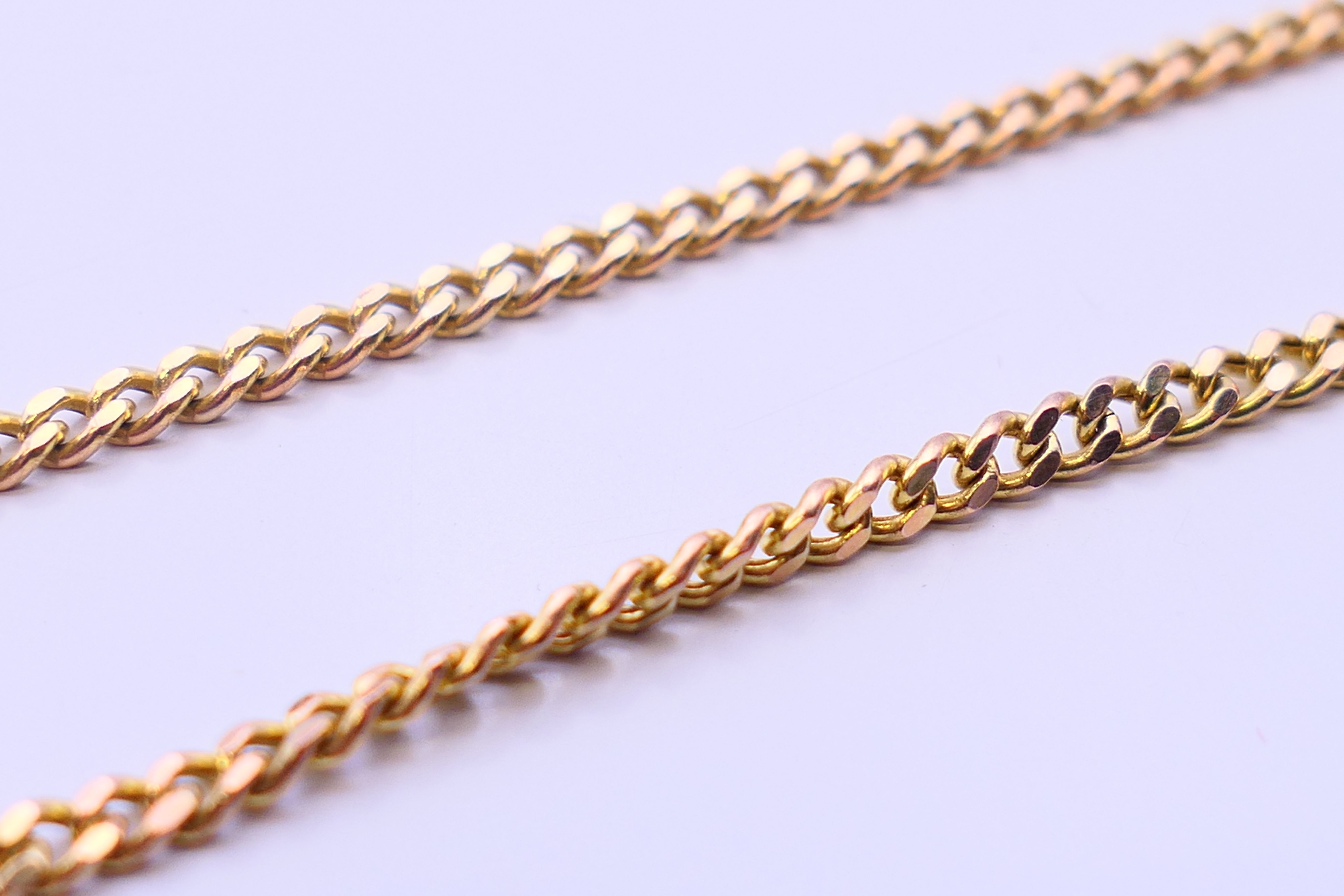 A Rotary fob watch on a 9 ct gold chain. 2.5 cm diameter, chain 62 cm long. The chain 6 grammes. - Image 8 of 8