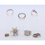 A quantity of various silver jewellery to include five rings, and two pairs of earrings.