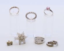 A quantity of various silver jewellery to include five rings, and two pairs of earrings.