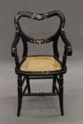 A Victorian mother-of-pearl inlaid lacquered child's chair.