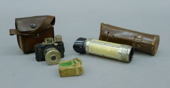 A 1935 Ulca STI camera and two spare film rolls and BEWI extinction light meter in a leather case.