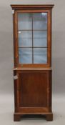 A Victorian glazed mahogany cabinet. 64 cm wide x 178 cm high.