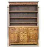 A 19th century oak dresser. 154 cm wide x 226 cm high.