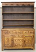 A 19th century oak dresser. 154 cm wide x 226 cm high.