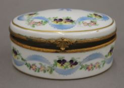 A Limoges porcelain trinket box. 9.5 cm wide.