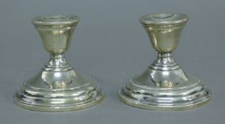 A pair of silver dwarf candlesticks. 8 cm high.