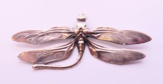 A large silver dragonfly brooch. 9.5 cm x 4 cm.