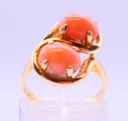 A 14 ct two-stone coral ring.
