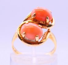 A 14 ct two-stone coral ring.