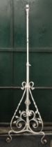 A Victorian wrought iron standard lamp. 177 cm high.