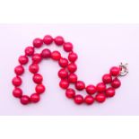A string of coral beads. 45 cm long.