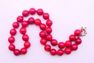 A string of coral beads. 45 cm long.