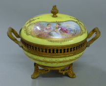 A 19th century yellow Sevres-style porcelain covered bowl. 17 cm wide.