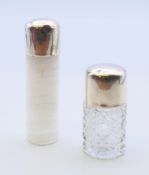 Two silver-topped glass scent bottles. The tallest 8 cm high.