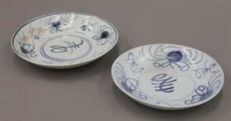 Two Chinese blue and white dishes underglazed with flowers (possible Ming). The largest 17.