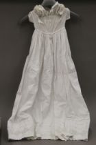 A quantity of linen and a christening gown.