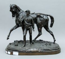 A 19th century bronze model of the racehorse 'Vainquer III' with jockey,