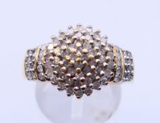 A 9 ct gold diamond cluster ring. Ring size P.
