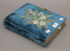 A Victorian photograph album. 22 cm wide.