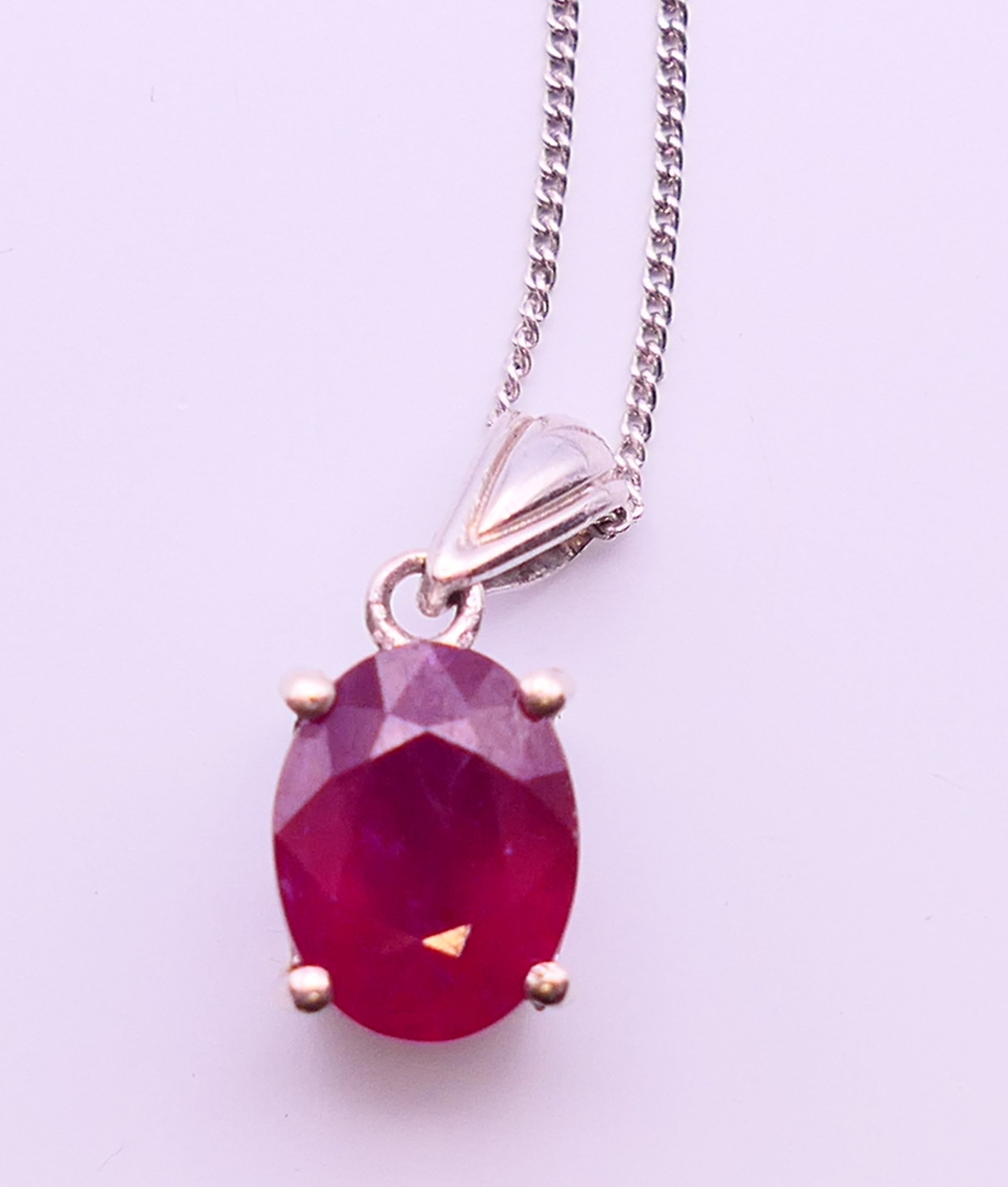 A silver ruby pendant on chain. Pendant 0.75 cm high, chain 45 cm long. - Image 2 of 5
