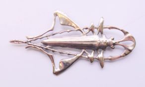 A large silver bug brooch. 9 cm wide.