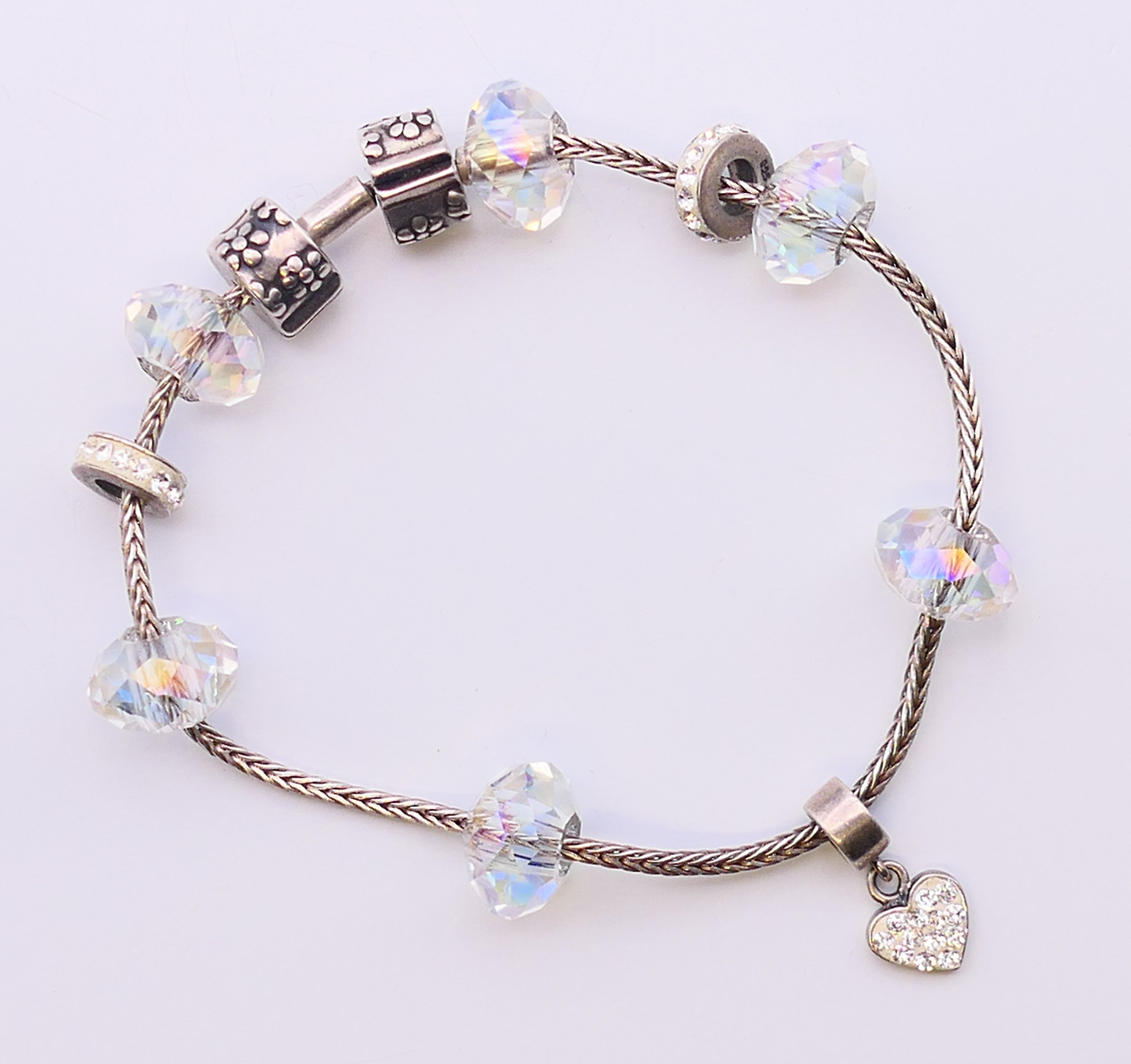 A silver bracelet with silver and bead charms. 17 cm long. - Image 3 of 5