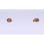 A pair of 9 ct gold diamond earrings. 0.5 ct weight.