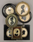 A quantity of 19th century silhouettes and miniatures. The smallest 8.5 x 11 cm.