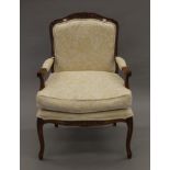 A modern upholstered open armchair. 67 cm wide.