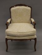 A modern upholstered open armchair. 67 cm wide.
