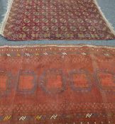 Two small red ground rugs. 103 x 173 cm and 123 x 152 cm.