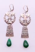 A pair of silver and jade Egypt revival earrings. 7 cm high.