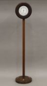 A Victorian mahogany clock and barometer on stand. 107.5 cm high.