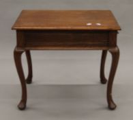 An early 20th century walnut sewing table. 52 cm wide.