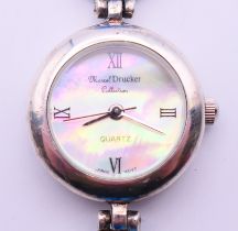 A Marcel Drucker silver wristwatch with millefiori glass bracelet. 20 cm long.