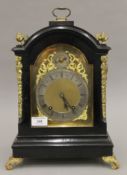 A late 19th century ebonised eight-day bracket clock with brass dial and silvered chapter ring.