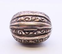 A Victorian silver nutmeg grater formed as a walnut. 4 cm wide.