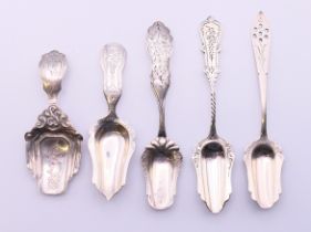 Five assorted continental silver caddy spoons. Largest 13 cm long. 51.3 grammes.