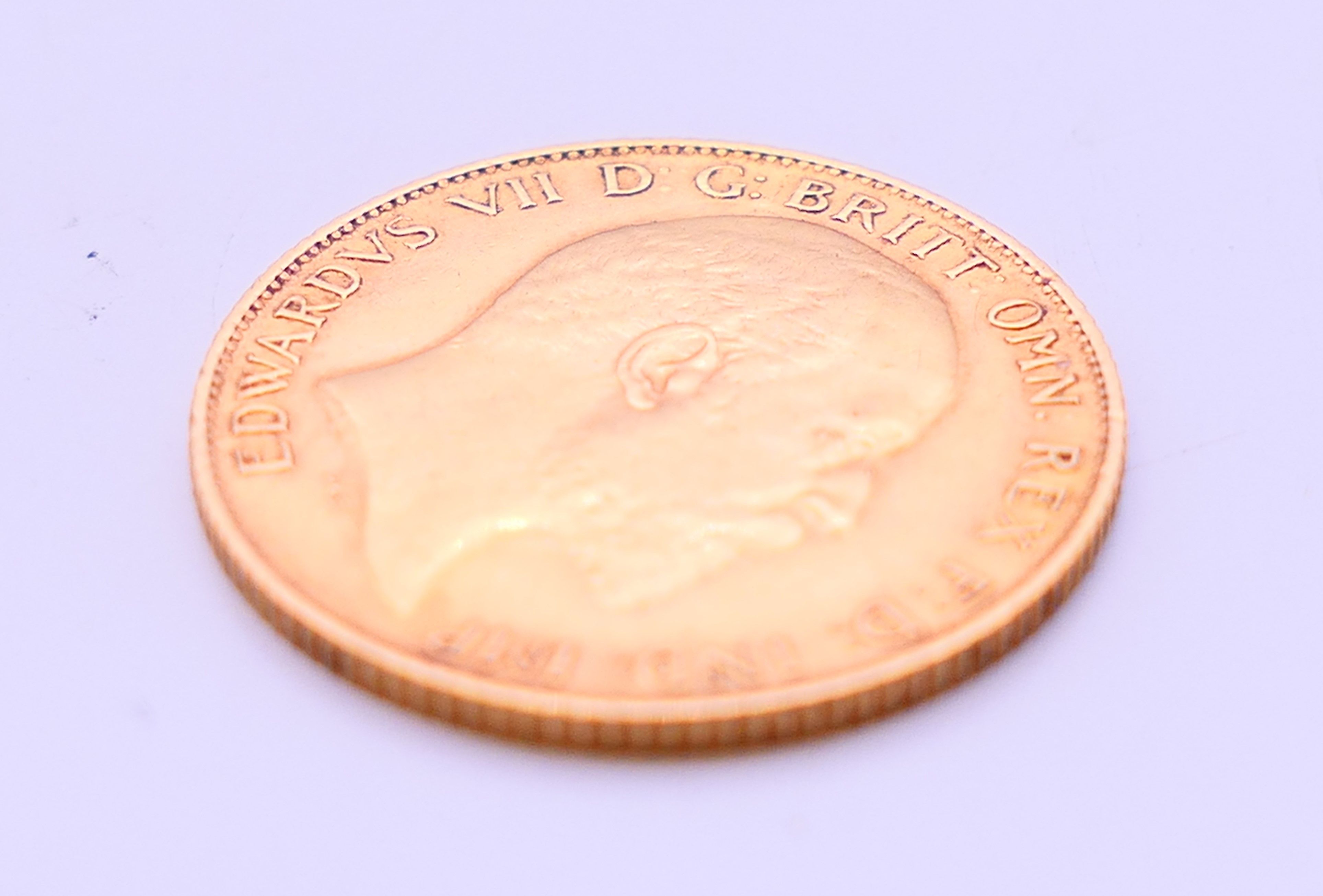 A gold half sovereign, dated 1909. - Image 3 of 3