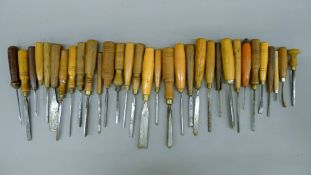 Thirty-two carving chisels.