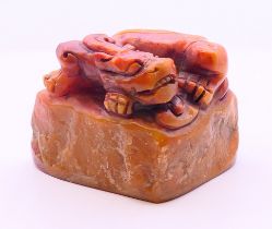 A hardstone dog-of-fo seal. 4 cm high.
