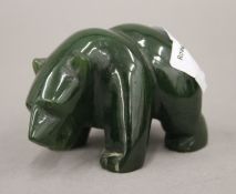 A jade model of a bear. 7 cm long.
