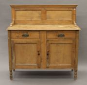 A Victorian pine two-drawer side cupboard . 123 cm wide.
